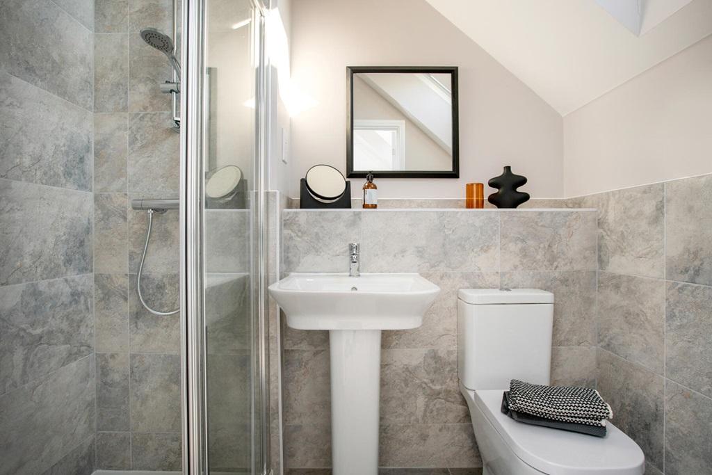 With stylish en-suite shower room