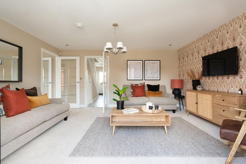 The living room offers plenty of space for the...