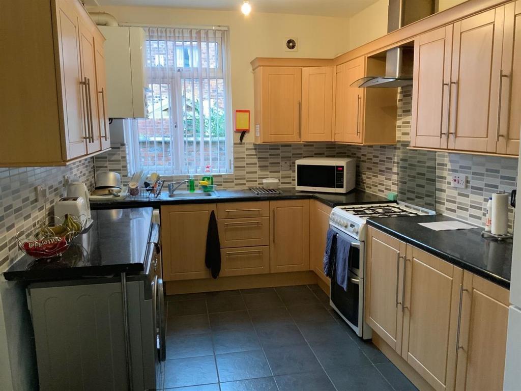 A modern, well-maintained kitchen featuring amp...