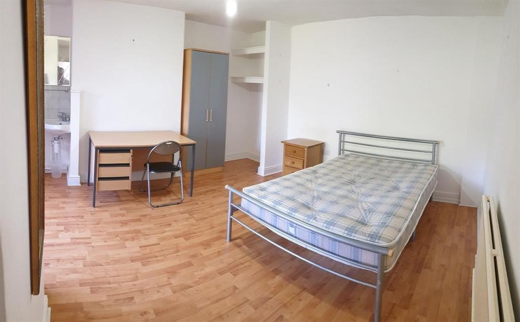 Bright and spacious living room with ample natu...