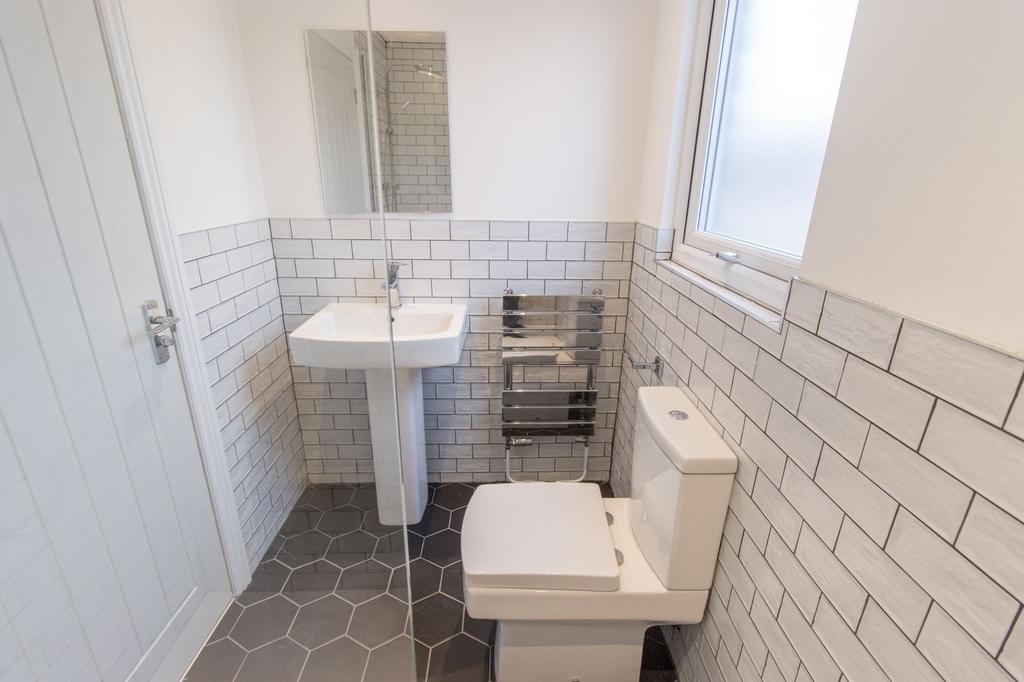 Bright, modern bathroom with white sanitaryware...