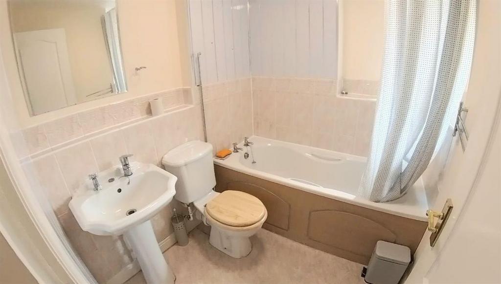 A clean and well-maintained bathroom featuring ...