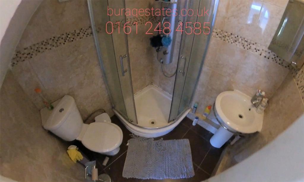 A clean and well-maintained bathroom with a sho...