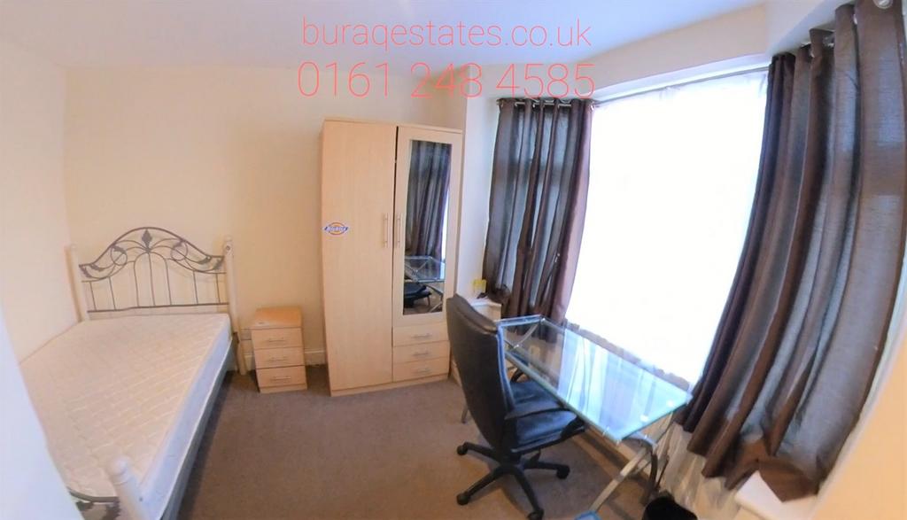 A well-maintained bedroom featuring a spacious ...