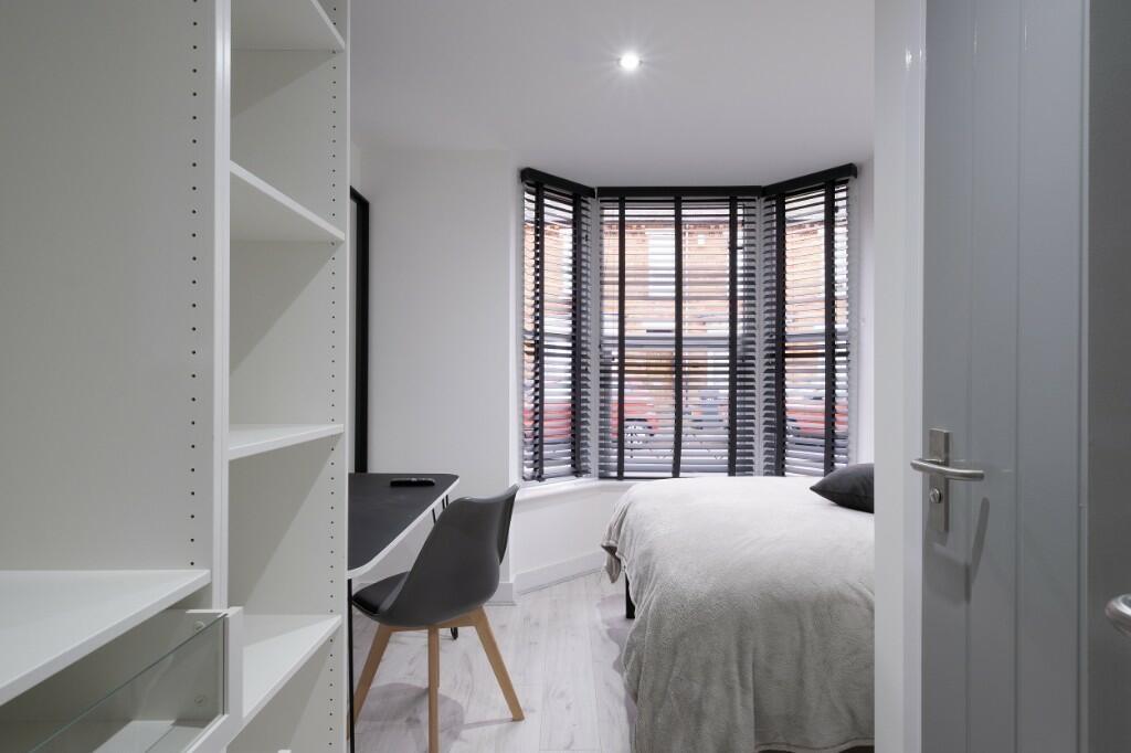 A bright and well-presented master bedroom feat...