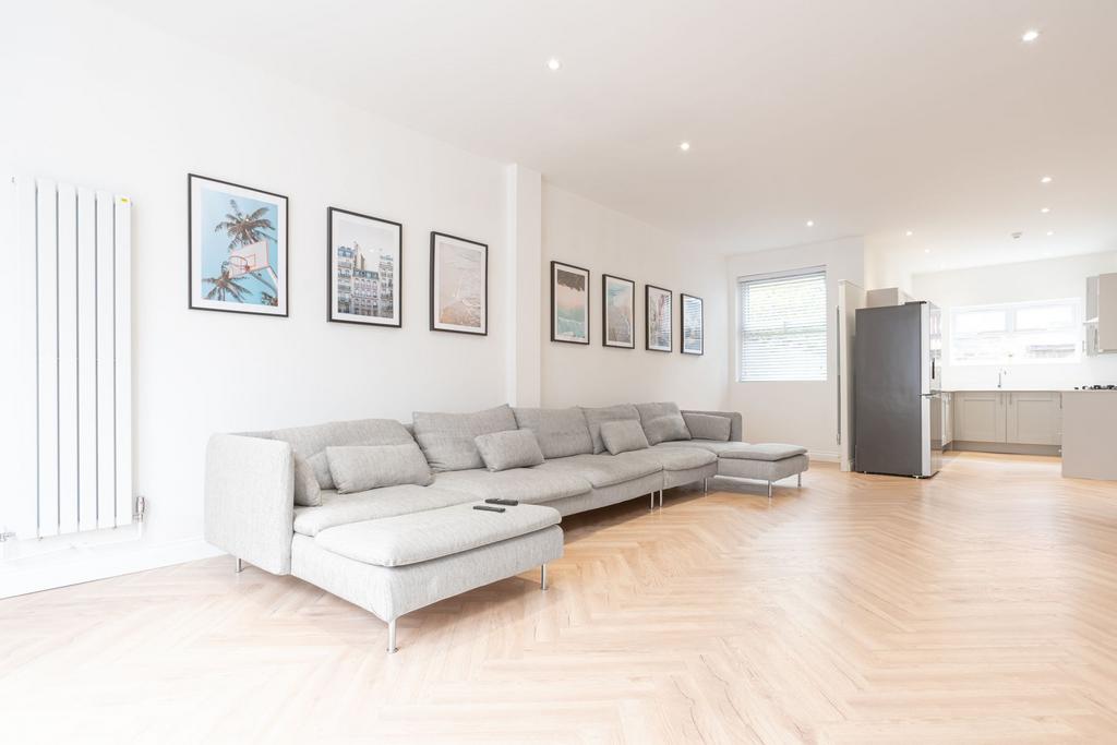 Bright, modern open-plan living room with a lon...