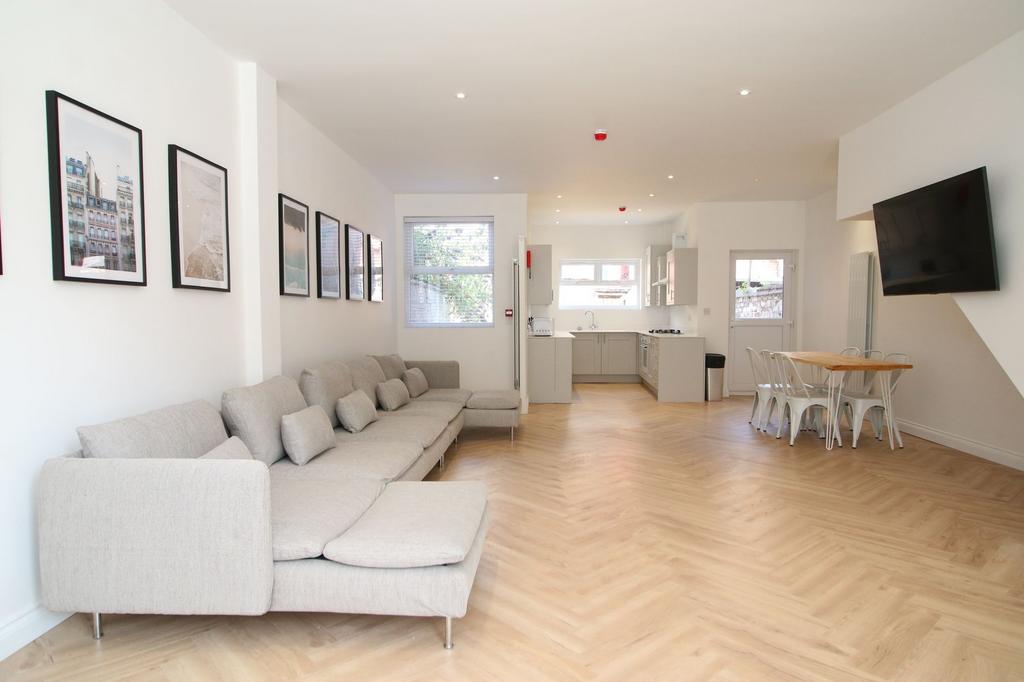 Bright, modern open-plan living space with a lo...