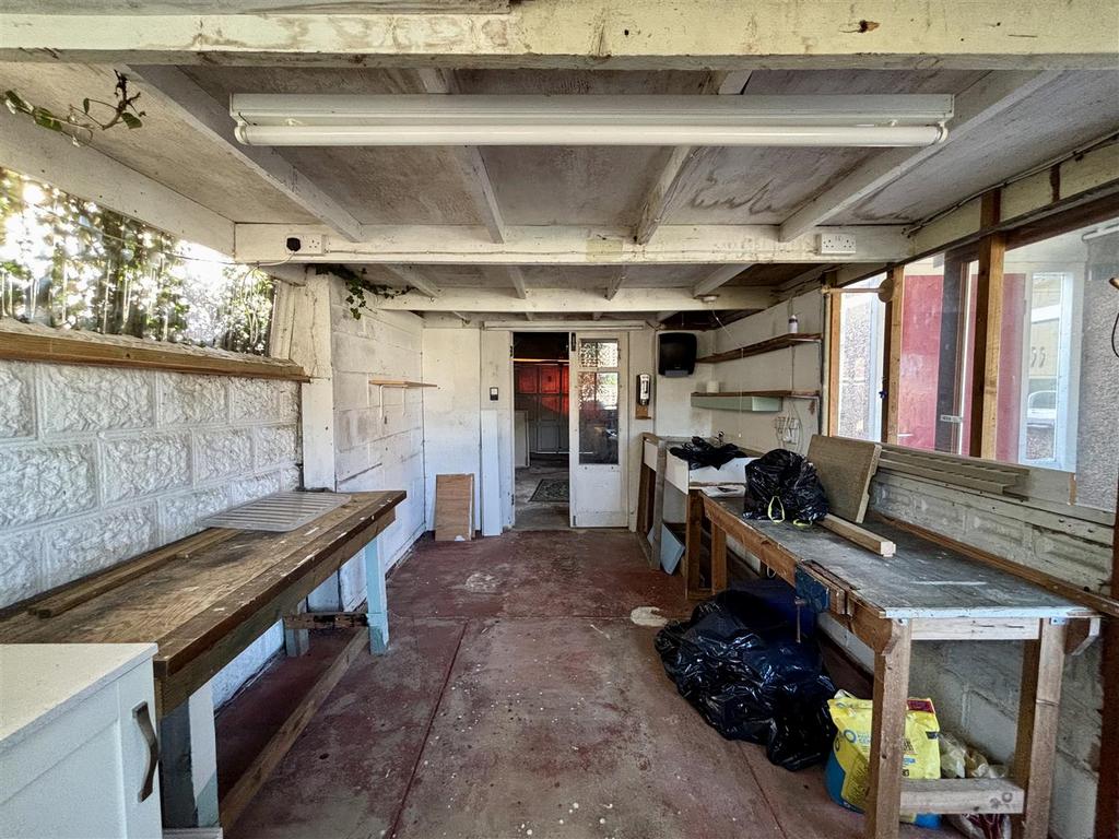 Workshop Leading To Garage