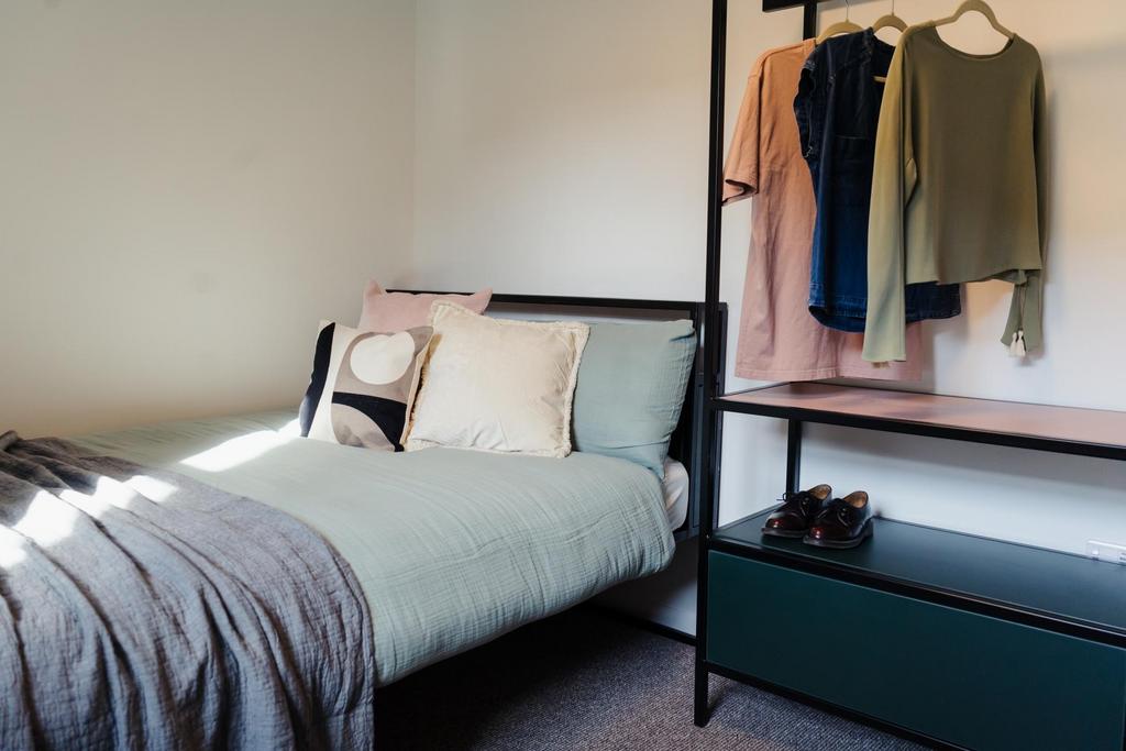 A well-maintained double bedroom featuring a ne...