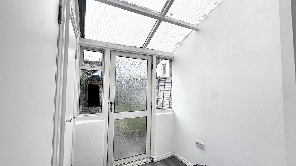 Bright enclosed porch or entrance hallway with ...