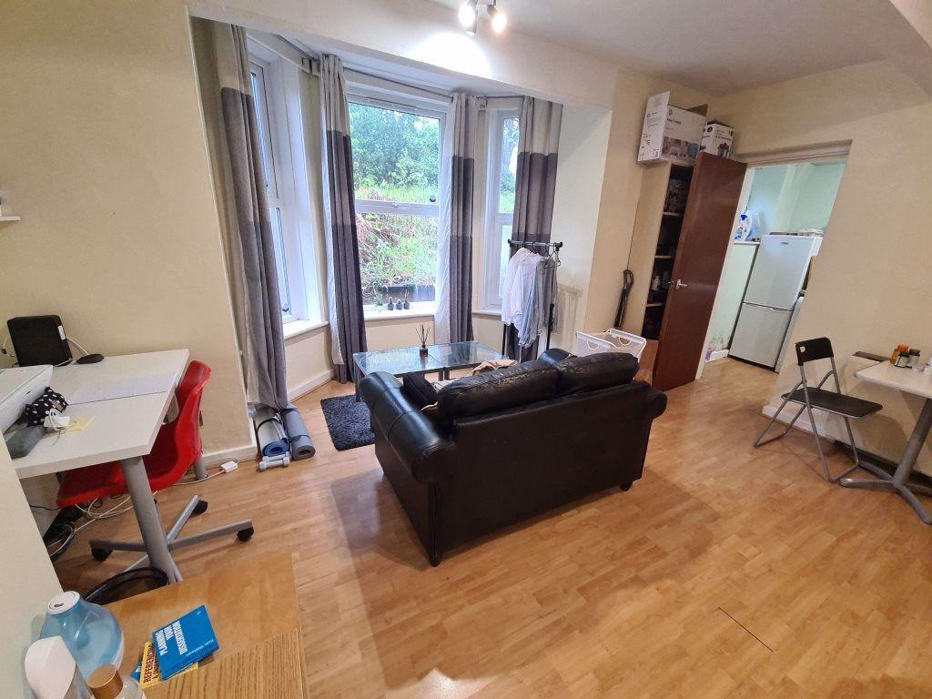 Bright and welcoming living room with ample nat...