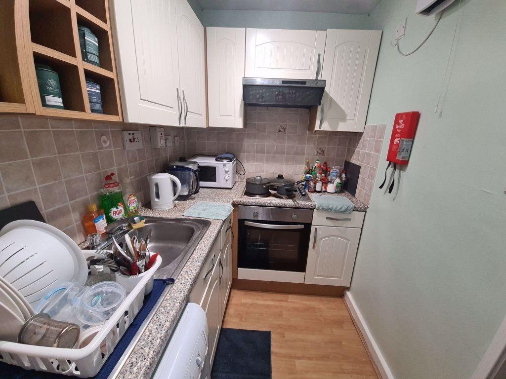 A well-maintained kitchen with ample storage, m...