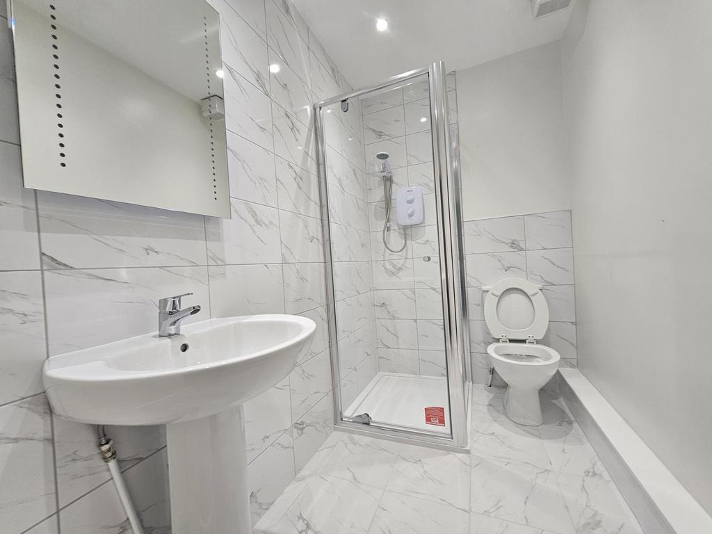 A modern, well-maintained bathroom with a spaci...