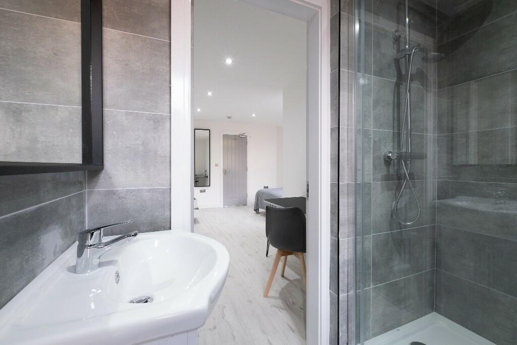 Modern and clean bathroom with a sleek shower e...
