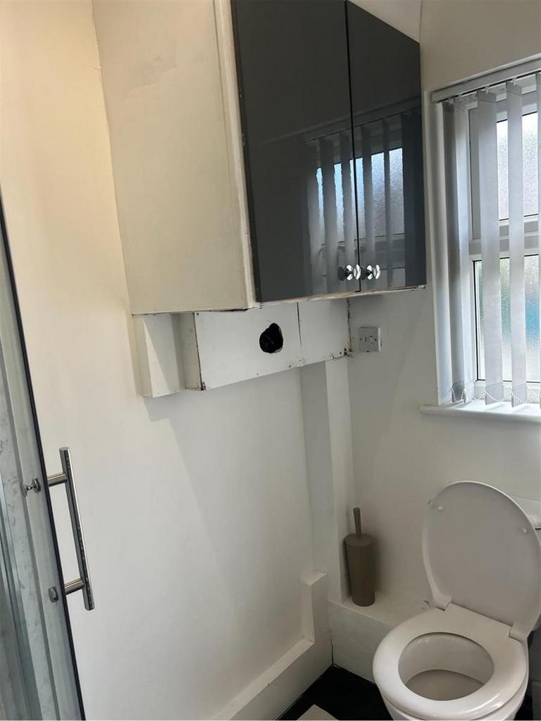 A clean and functional bathroom featuring a toi...