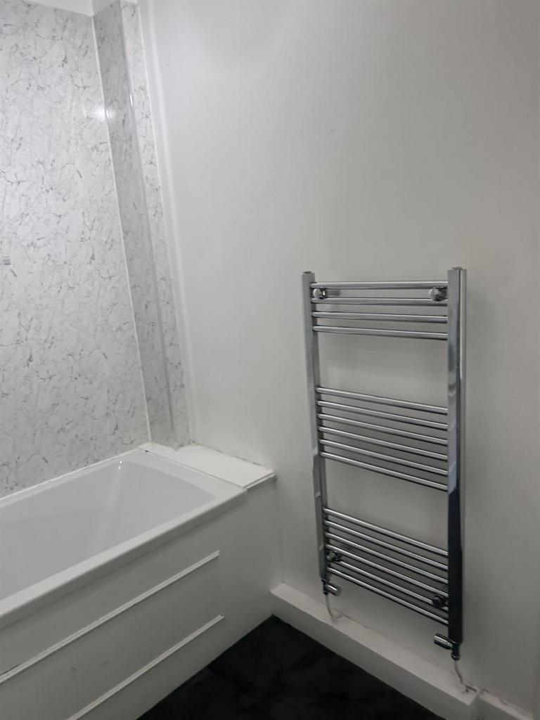 A clean and functional bathroom featuring a bat...