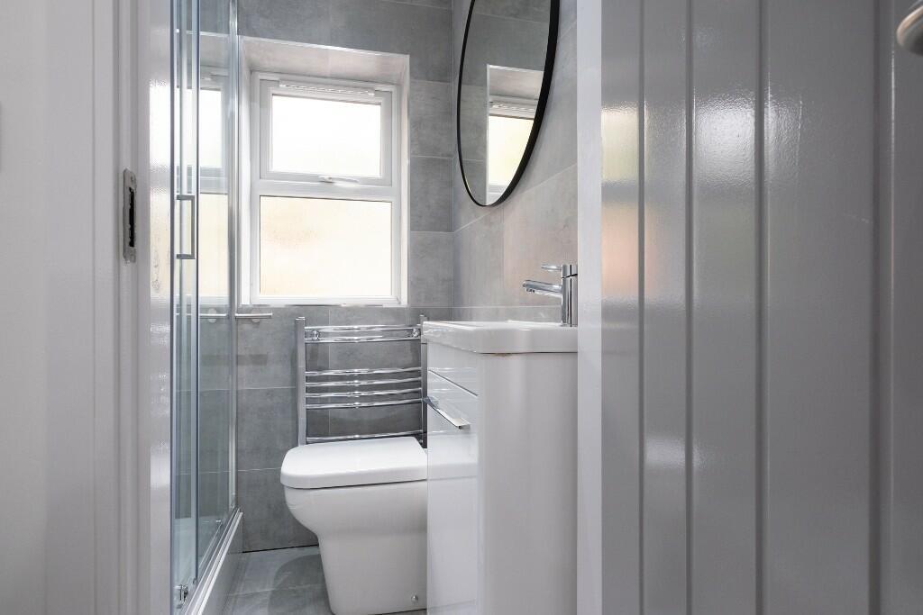 A modern, well-maintained bathroom featuring a ...