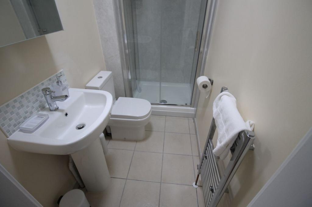 A clean and well-maintained bathroom featuring ...