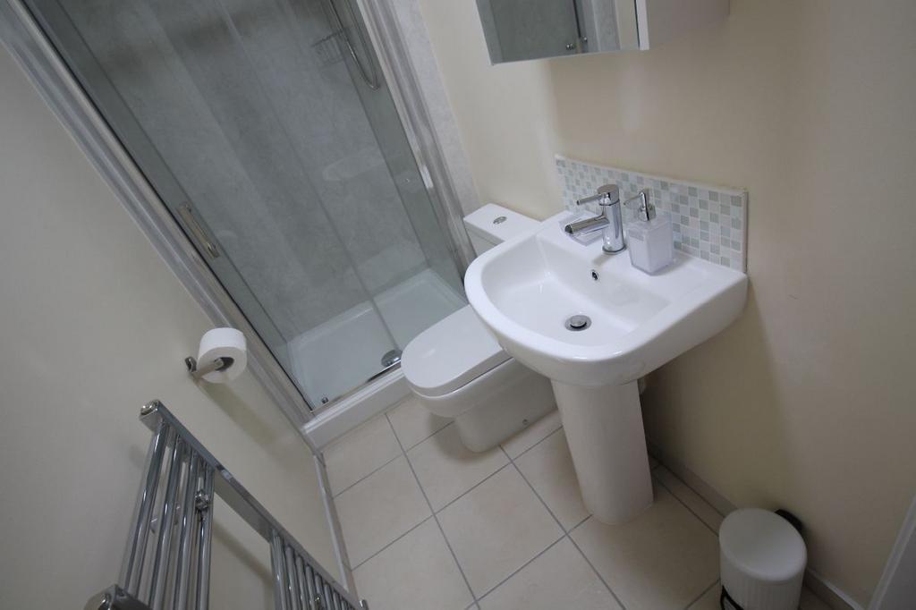 A clean and well-maintained bathroom featuring ...