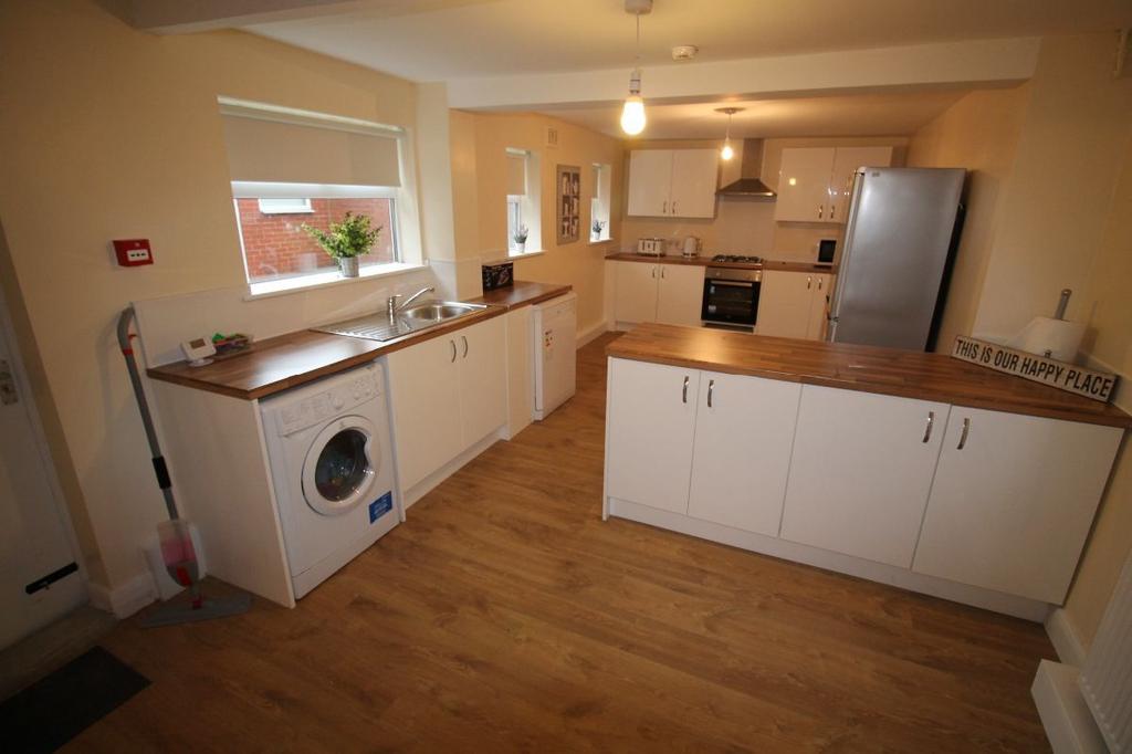 A bright and modern kitchen with ample workspac...