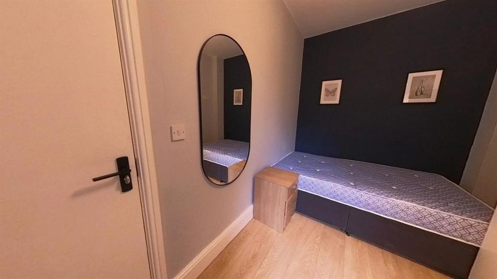 Neat, modern single bedroom with a built-in bed...