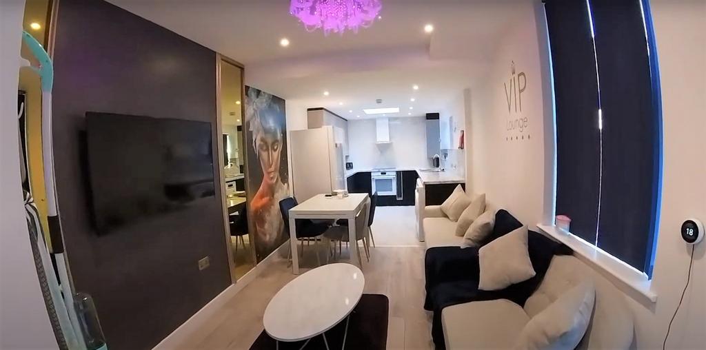 A modern, well-lit living room with contemporar...