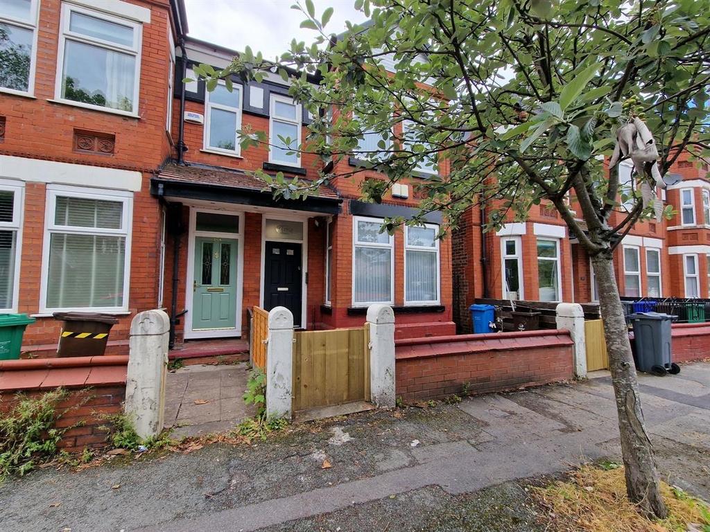 A charming view of the front exterior of a terr...
