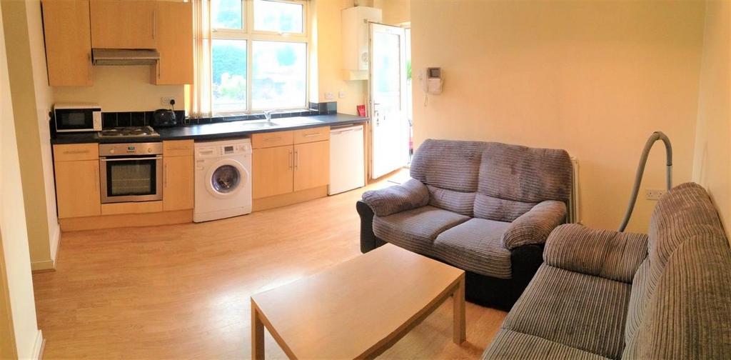 A spacious and well-lit contemporary living roo...