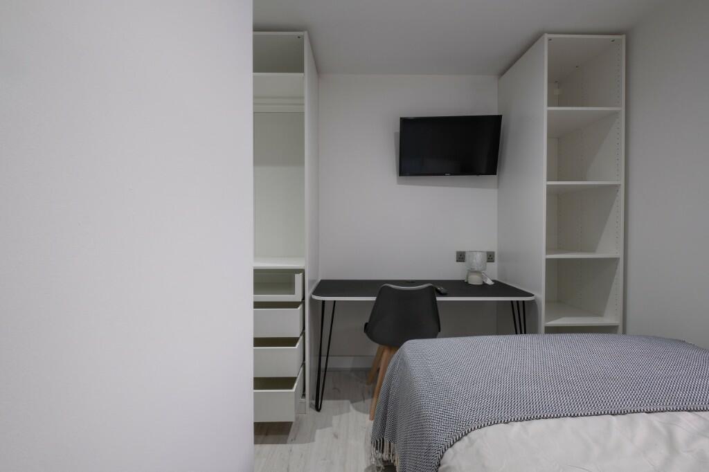 Neatly presented bedroom with a tidy single bed...