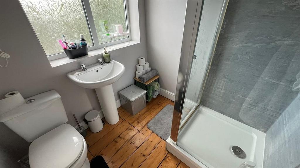 Bright, well-kept bathroom with a walk-in showe...