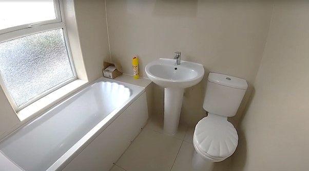 A clean and well-maintained bathroom with a bat...