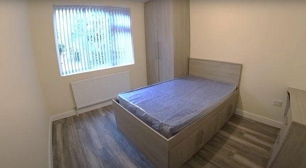 A cozy single bedroom with a linked double bed,...