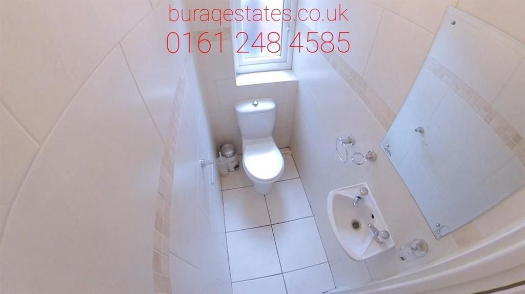 A clean and well-maintained bathroom with a toi...