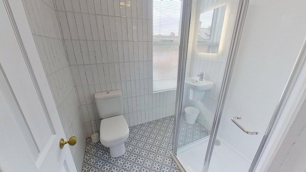 Bright and clean bathroom featuring a spacious ...