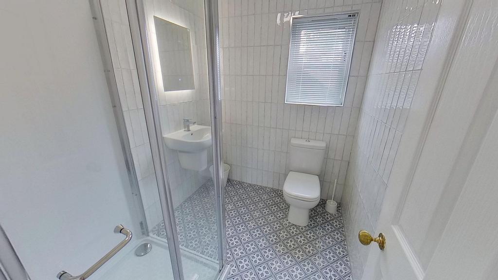 A clean, well-maintained bathroom featuring a S...