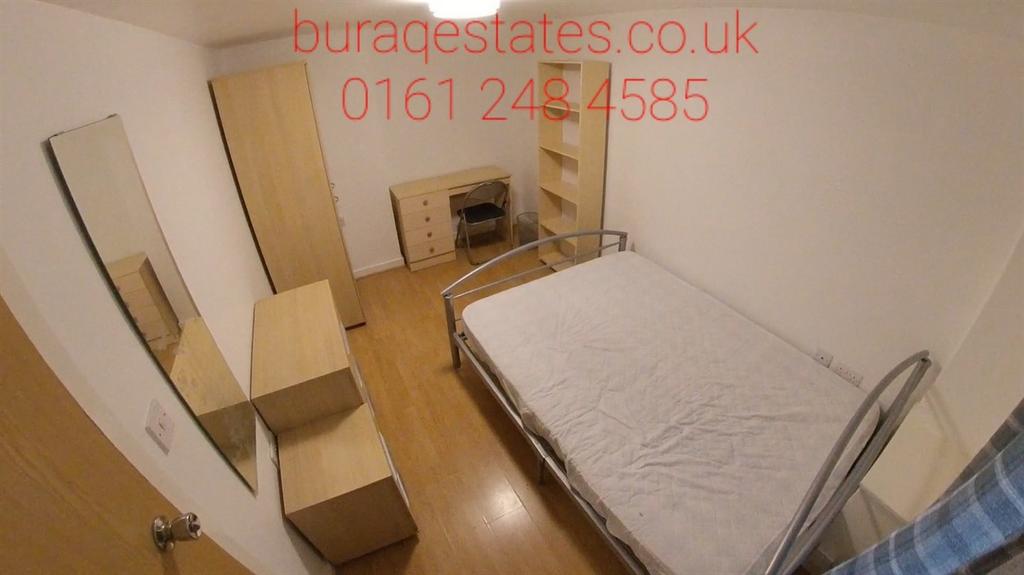 Bright, simply furnished double bedroom with a ...