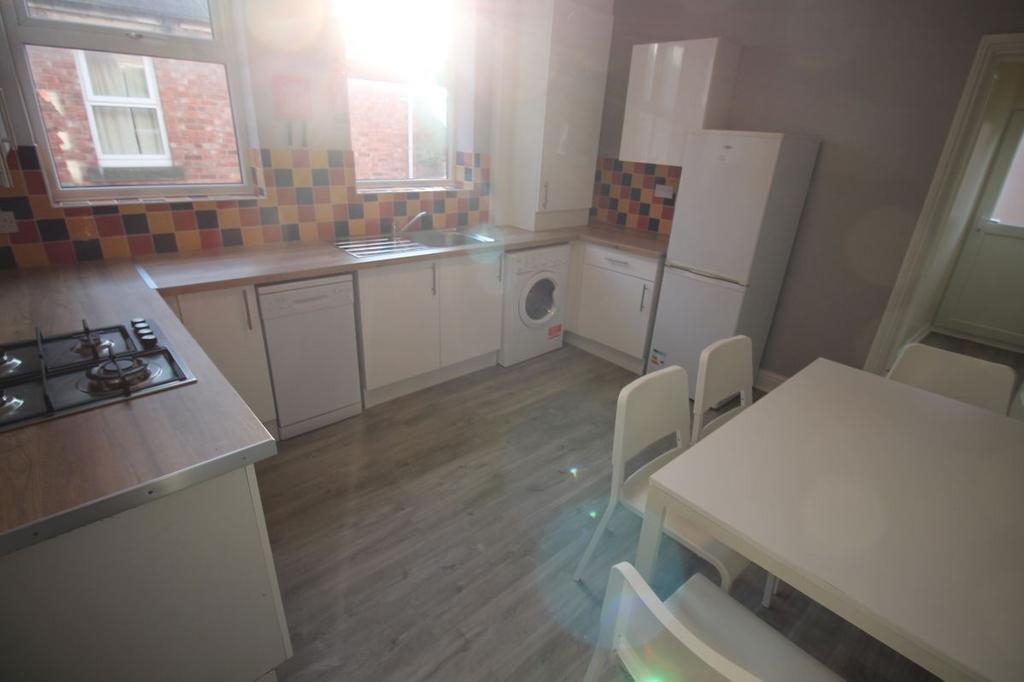 Bright and clean kitchen with ample natural lig...