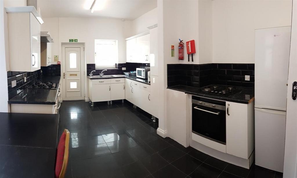Bright and modern kitchen area featuring white ...