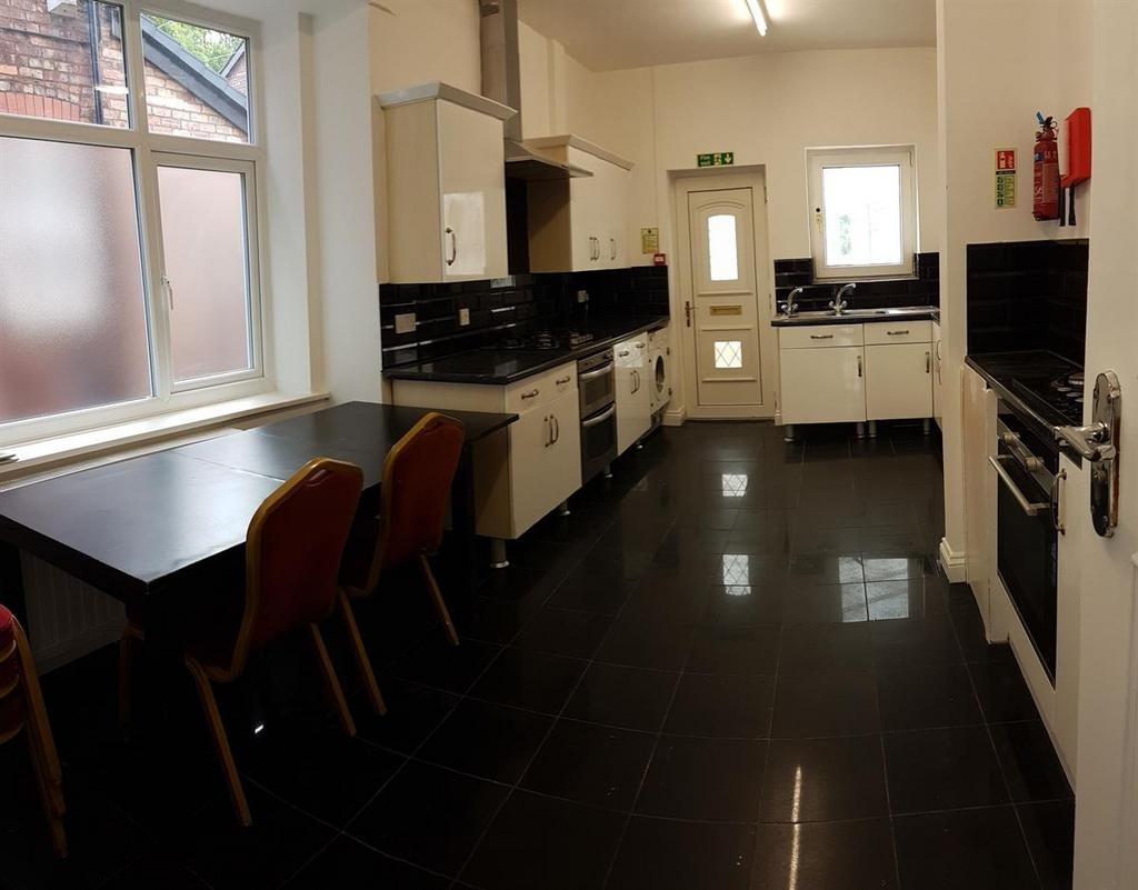 A bright and modern kitchen with ample counter ...