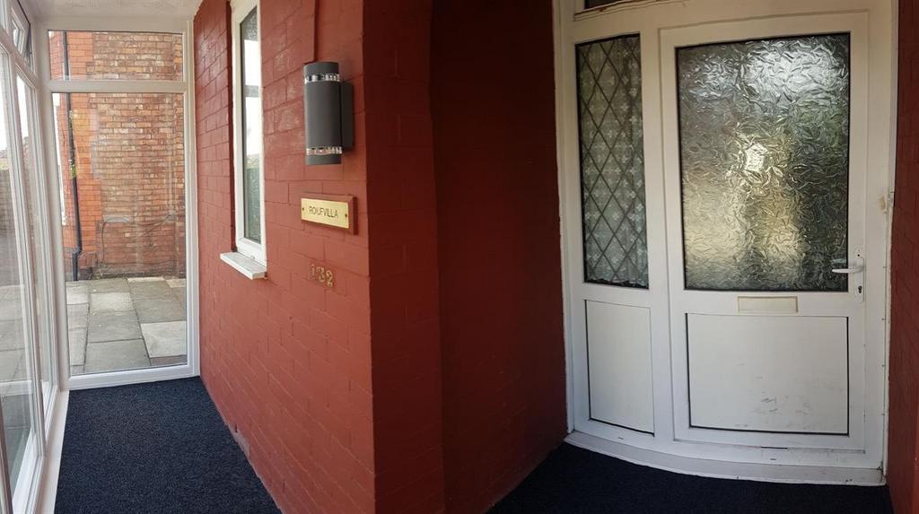 A clear view of the front entrance of a residen...