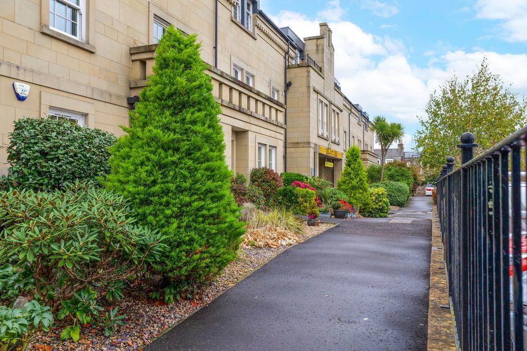 Pedestrian walkway and well-maintained gardens