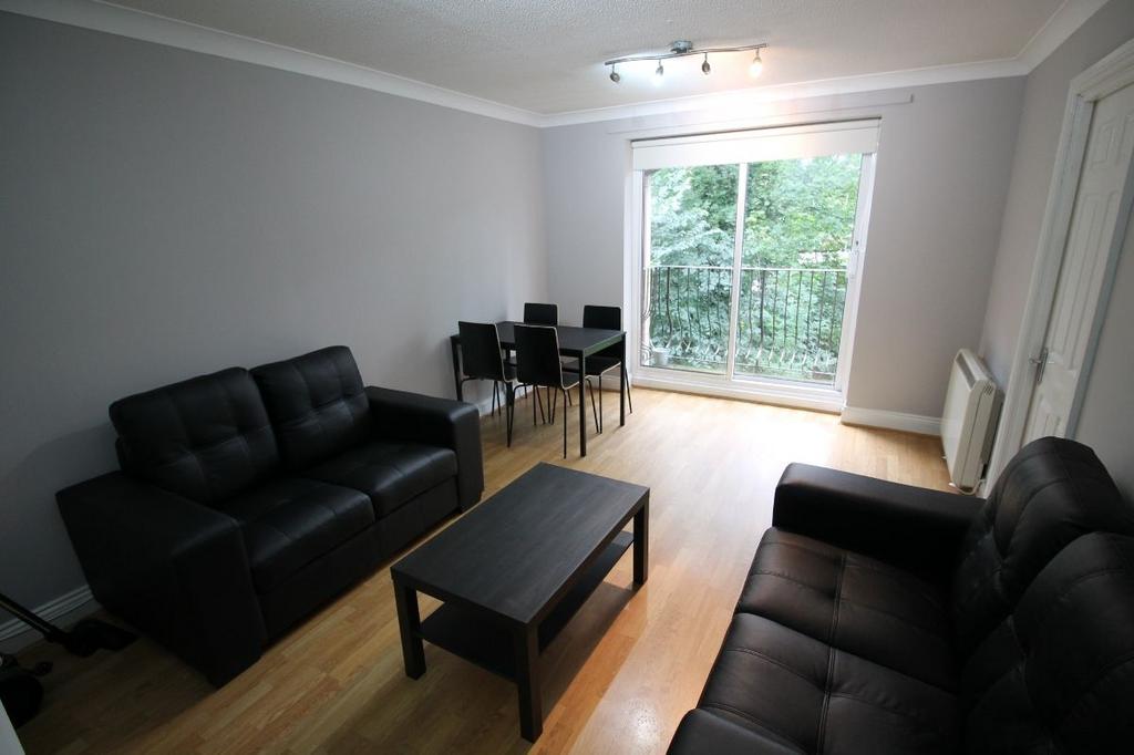 A spacious and modern living room with large wi...