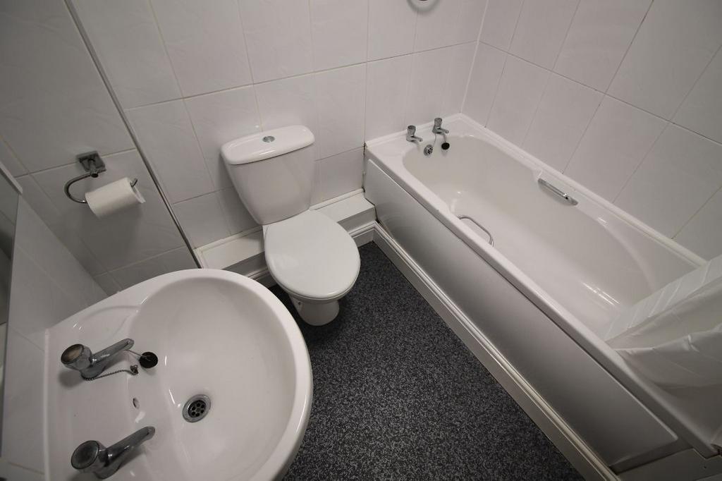 A clean and functional bathroom featuring a bat...