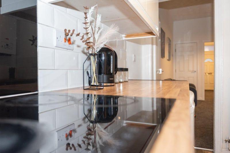 Bright, modern kitchen countertop with a sleek ...