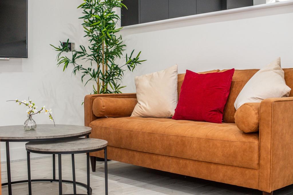 A welcoming and modern living room featuring a ...