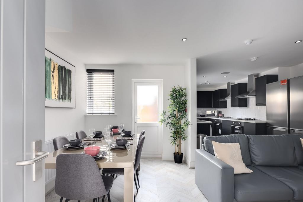 Bright, modern living space featuring a comfort...