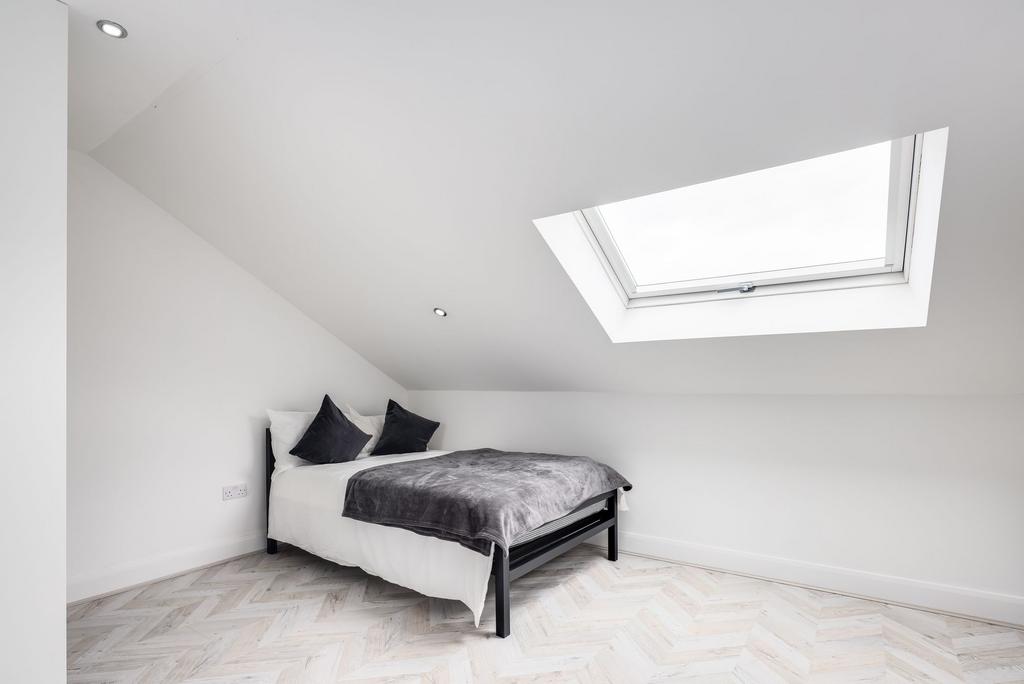 Bright and modern double bedroom with a large s...