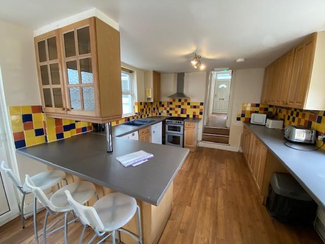 Bright and well-maintained kitchen featuring am...