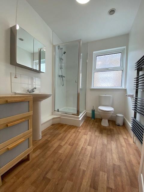 Bright and well-maintained bathroom with a mode...