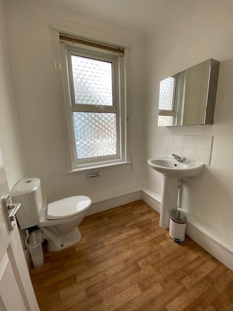 A clean and well-maintained bathroom featuring ...